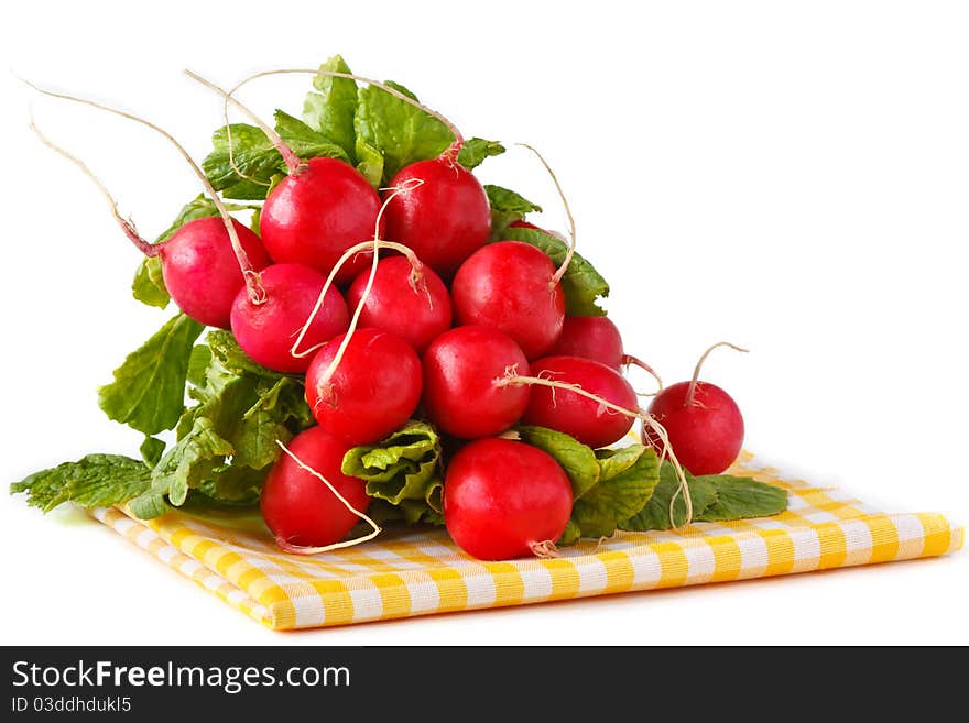 Bunch of fresh radish on a yellow napkin. Bunch of fresh radish on a yellow napkin.