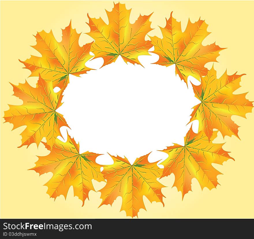 A circle of autumn leafs on a light orange background. A circle of autumn leafs on a light orange background