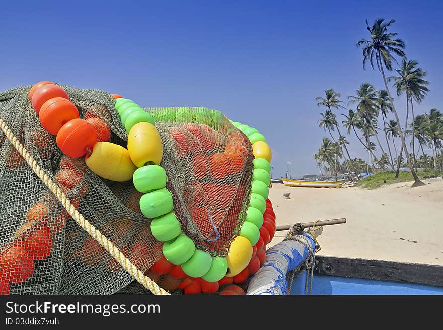 Boat of fishermen on the beach in Goa, India. Boat of fishermen on the beach in Goa, India.