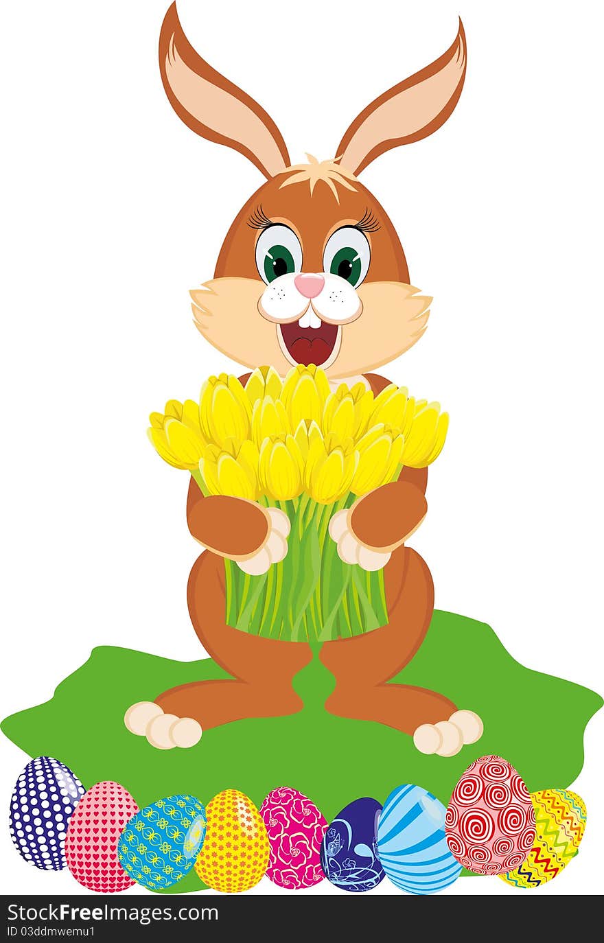 Easter rabbit with spring flowers yellow tulips and the colored eggs