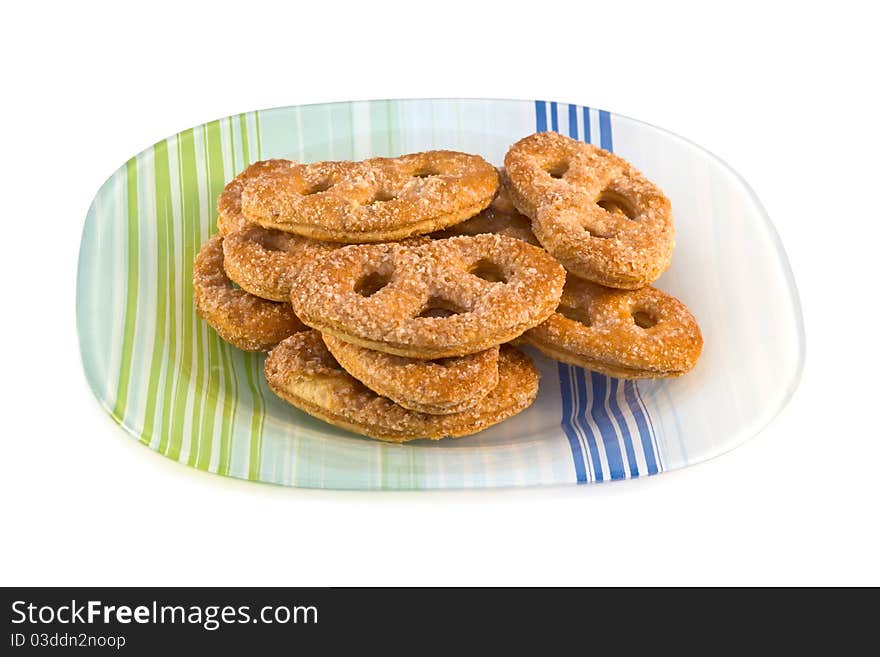 Plate of fresh baked cookies isolated on a white background.