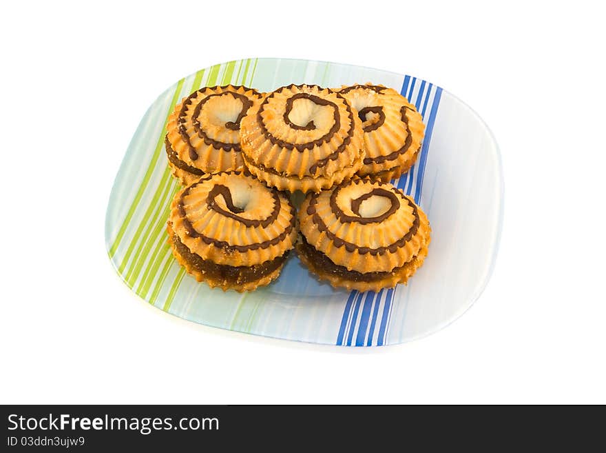 Plate of fresh baked cookies isolated on a white background.