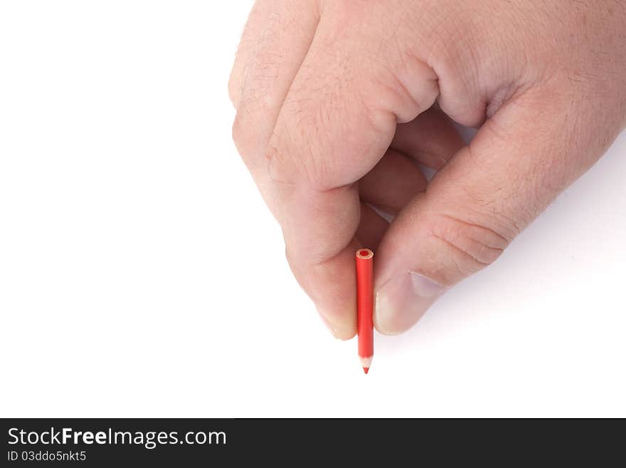 Mans hand holding a tiny red pencil on a white background. Mans hand holding a tiny red pencil on a white background