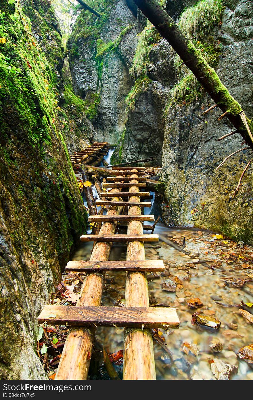 Mountain stream with ladder in canyon. Mountain stream with ladder in canyon