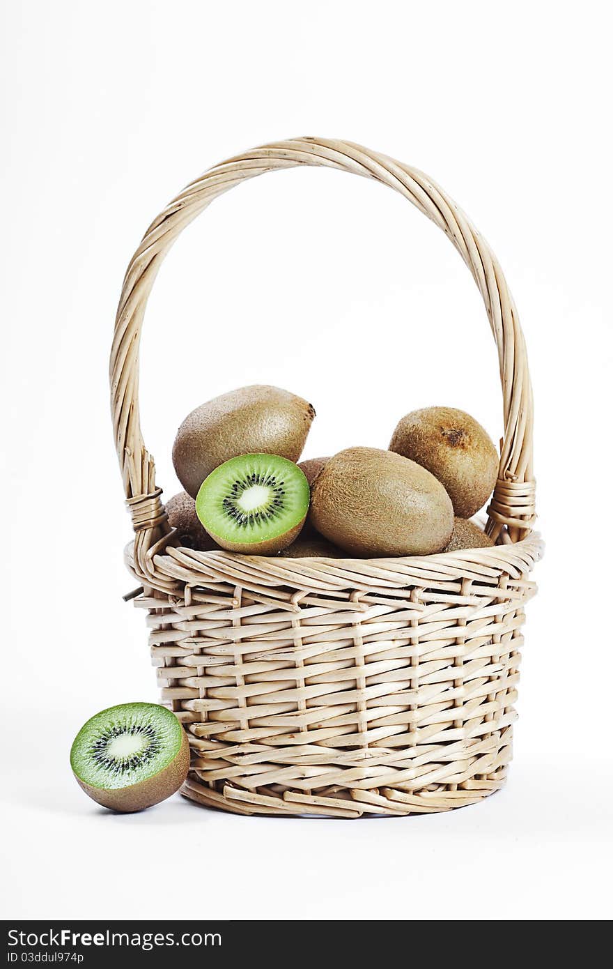 Wicker basket full of fresh juicy kiwi fruits. Wicker basket full of fresh juicy kiwi fruits