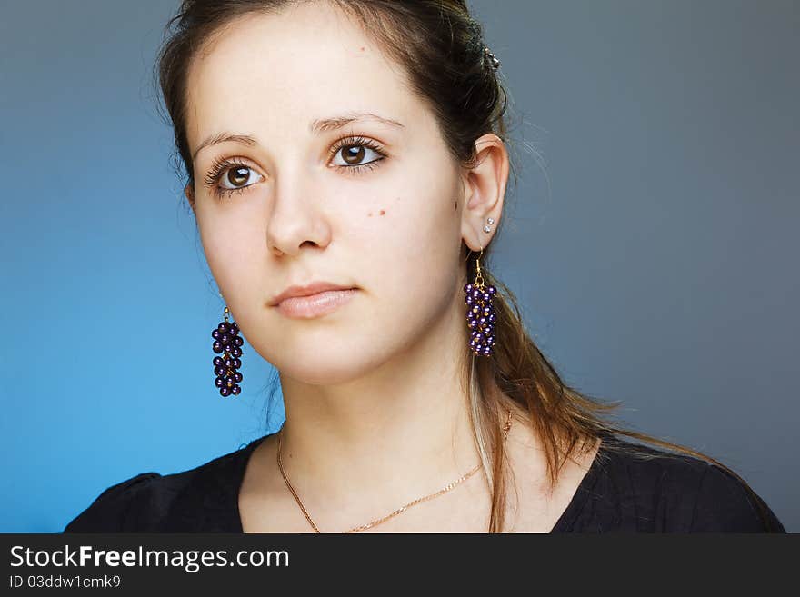 Portrait of elegant beautiful woman wearing jewelry.