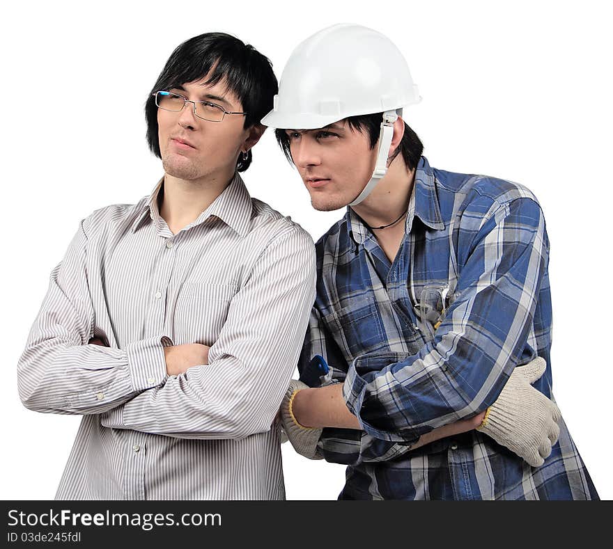 Twin brothers are standing close to each other while checking out results of their work. Twin brothers are standing close to each other while checking out results of their work