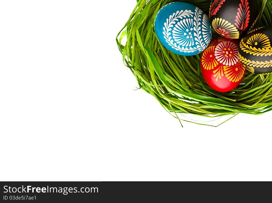 Easter Eggs In Nest On Green