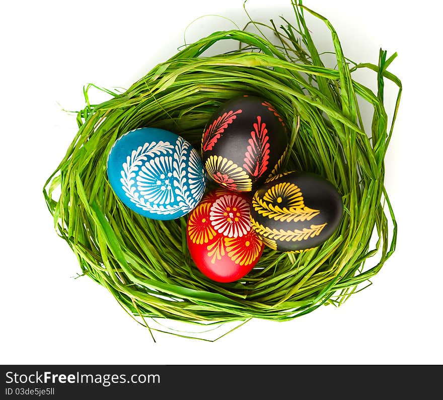 Painted easter eggs in basket on white background. Painted easter eggs in basket on white background