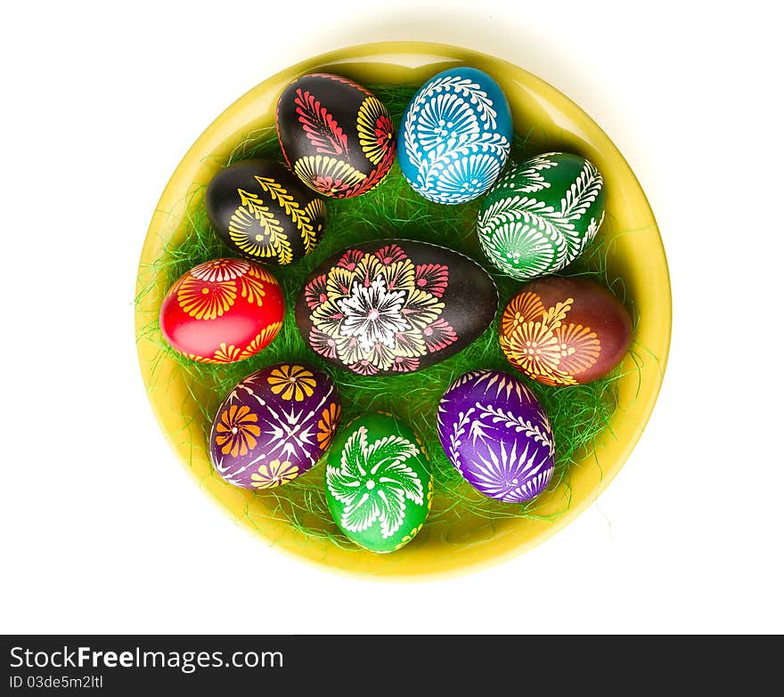 Painted Easter eggs on yellow plate. Painted Easter eggs on yellow plate