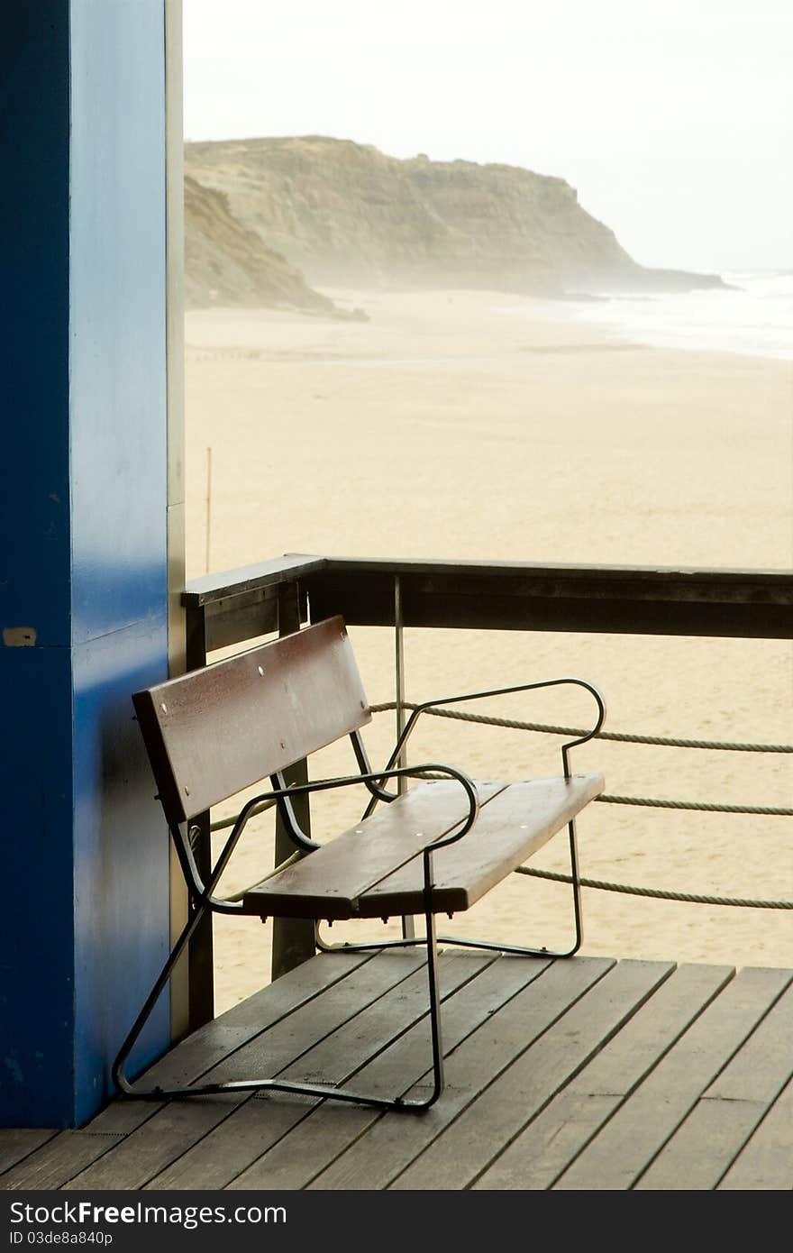 Empty bench at empty beach