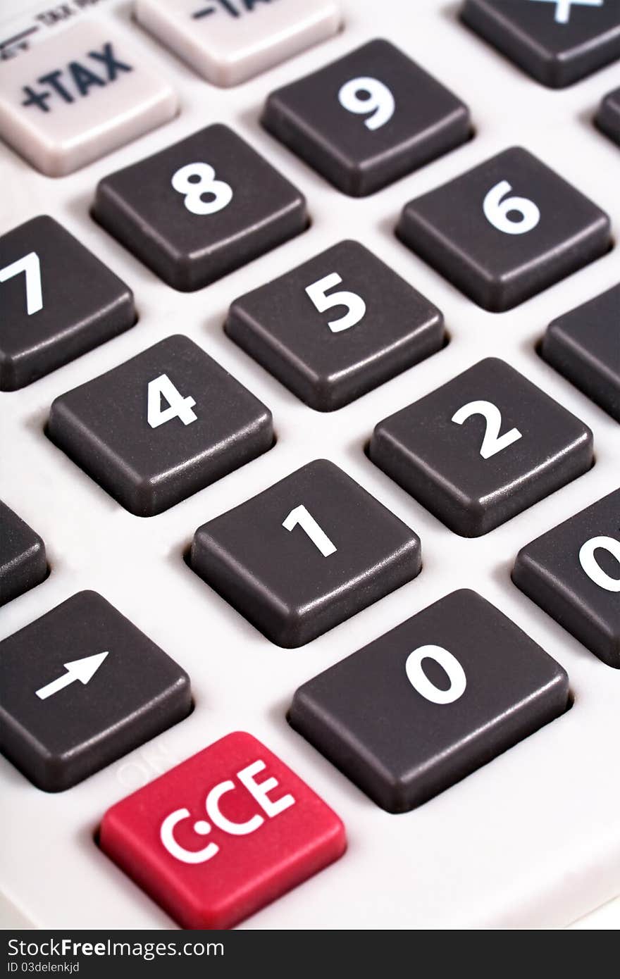 Grey buttons on white calculator close-up. Grey buttons on white calculator close-up