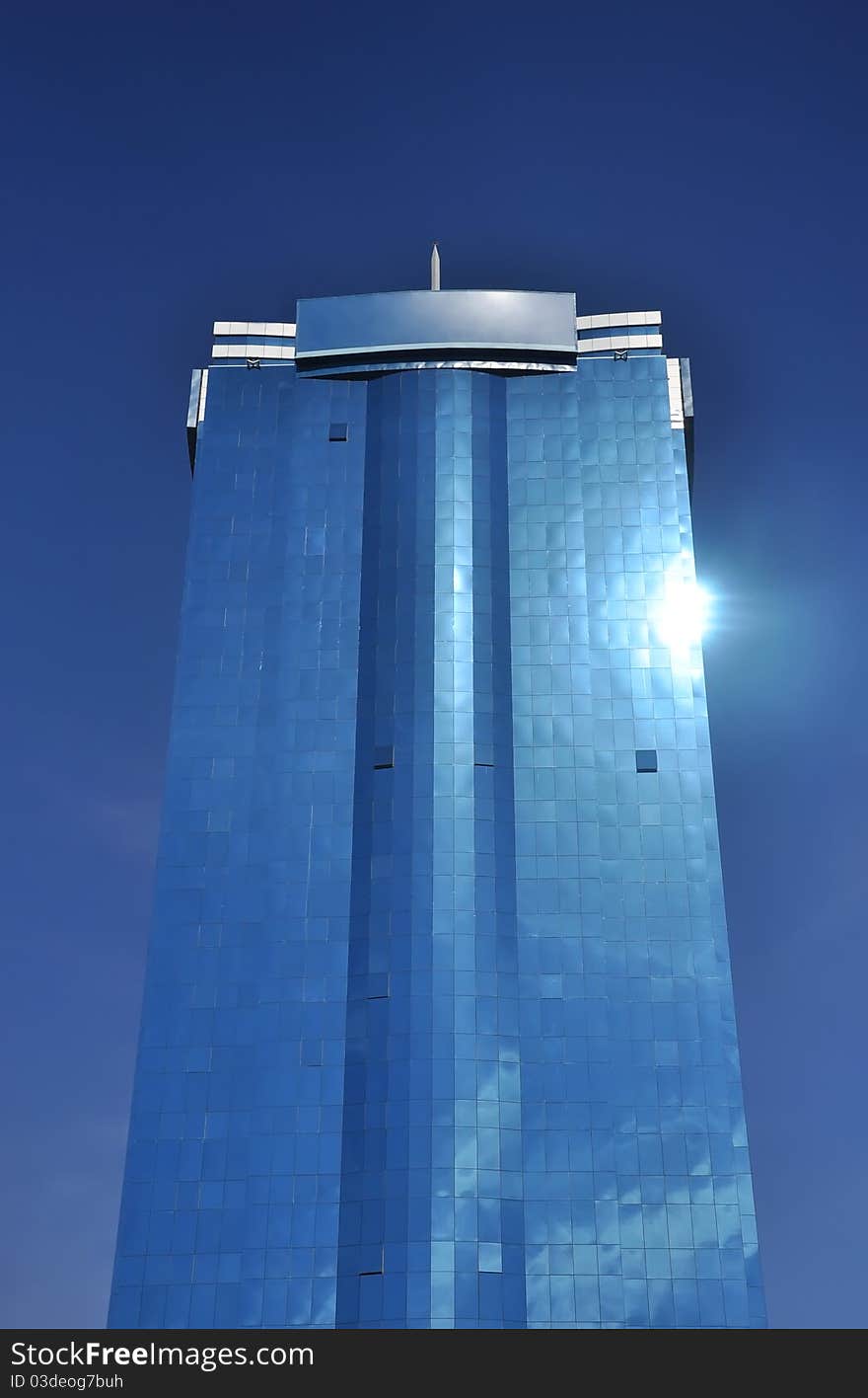 Tall Office Building Against Blue Sky