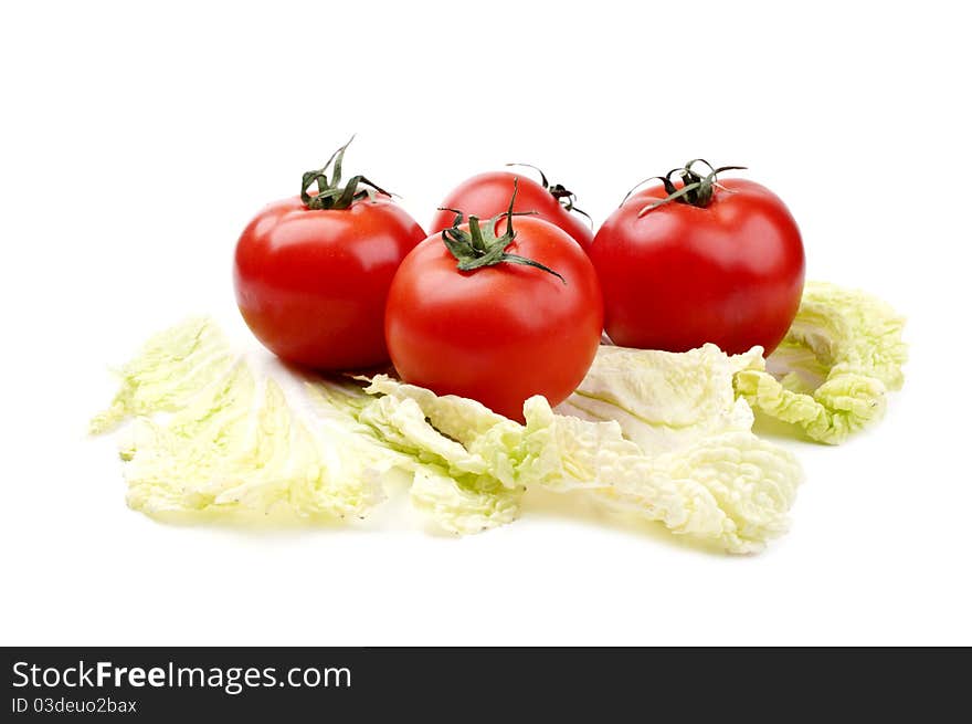 Tomatoes and cabbage isolated on a white background