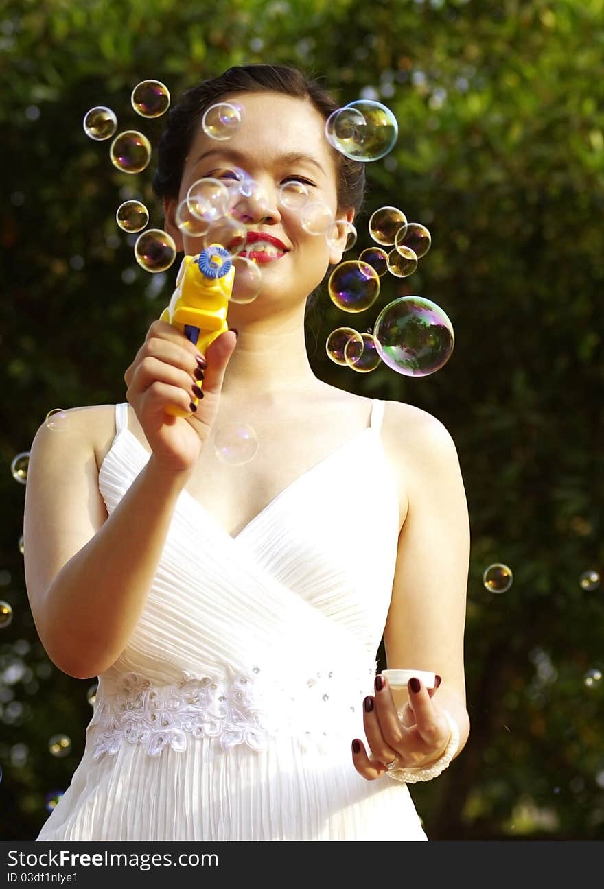 Young woman with soap bubbles