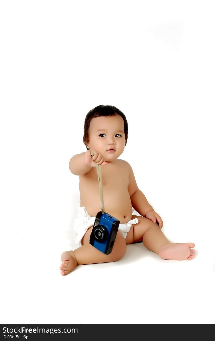 a chubby little girl sit with a vintage camera isolated on white background