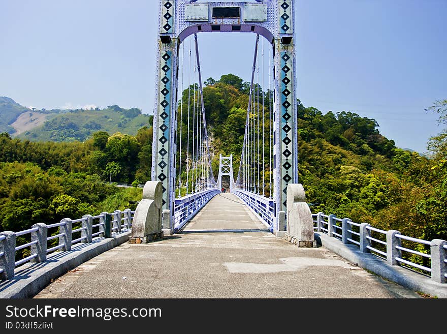 A suspension bridge across mountains