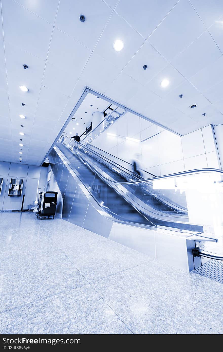 People At The Airport Escalator