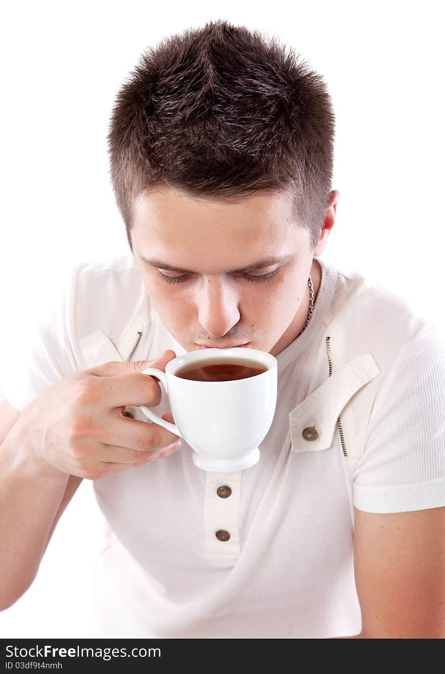 Young man with fresh cup of black tea. Young man with fresh cup of black tea