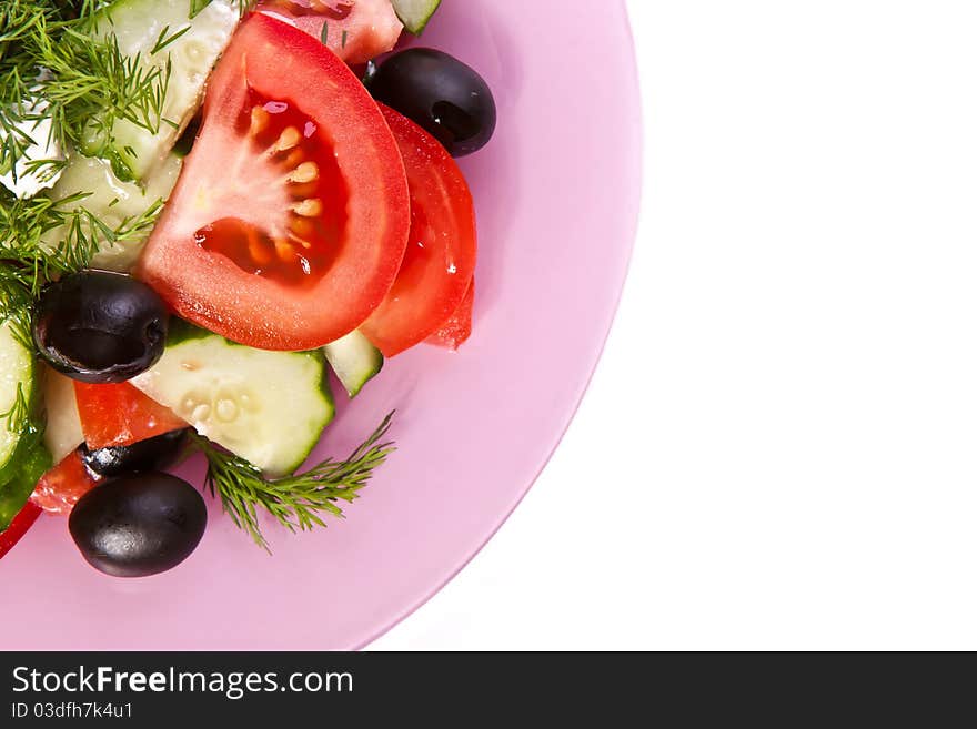 Plate of fresh vagetable salad across white. Plate of fresh vagetable salad across white