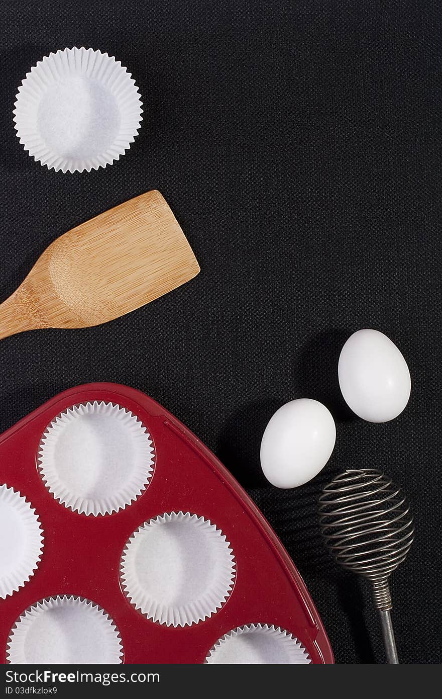 Silicone bakeware red with paper cups for baking.