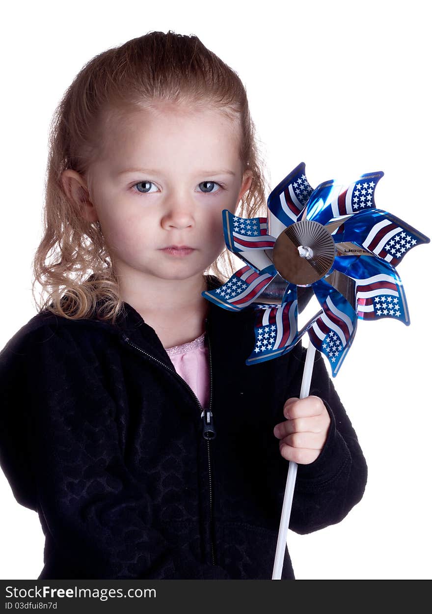 Fourth of July Photograph of a young girl holding an American windmill. Fourth of July Photograph of a young girl holding an American windmill.