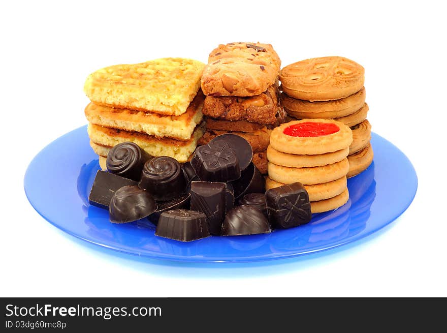 Chocolat and cookies on the plate on a white background. Chocolat and cookies on the plate on a white background