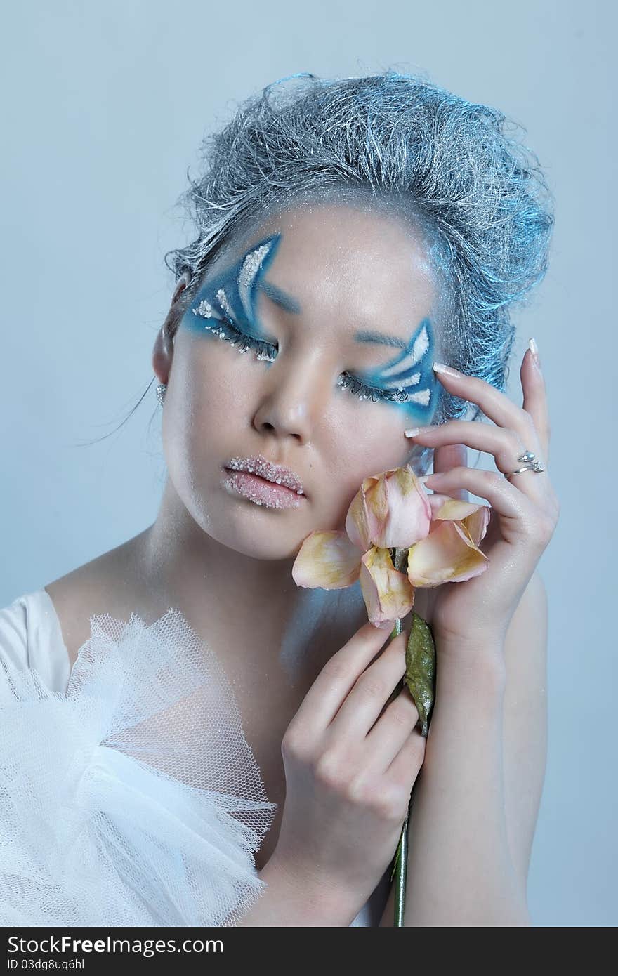 Portrait of woman with creative makeup and flower. Portrait of woman with creative makeup and flower