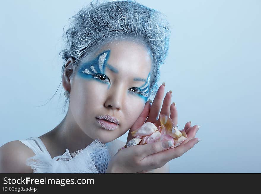 Portrait of woman with creative makeup and flower. Portrait of woman with creative makeup and flower