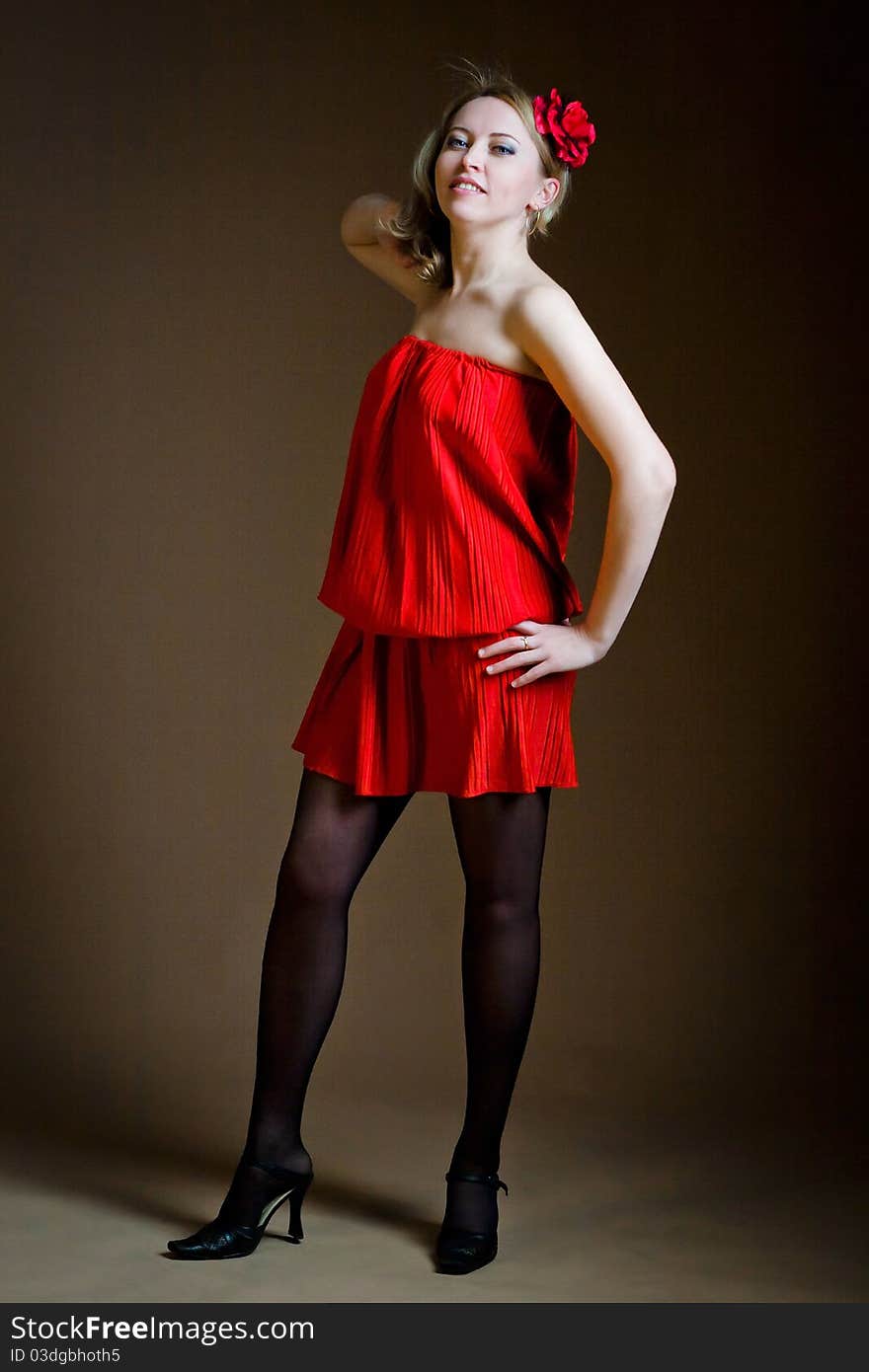 Portrait of attractive woman in red dress