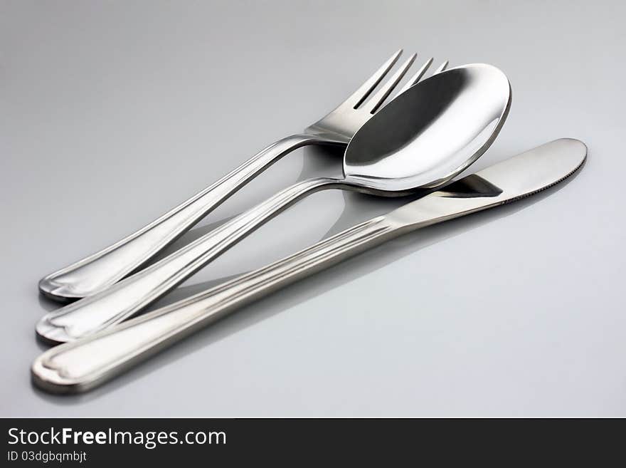 Table knife and fork, studio shot. Table knife and fork, studio shot