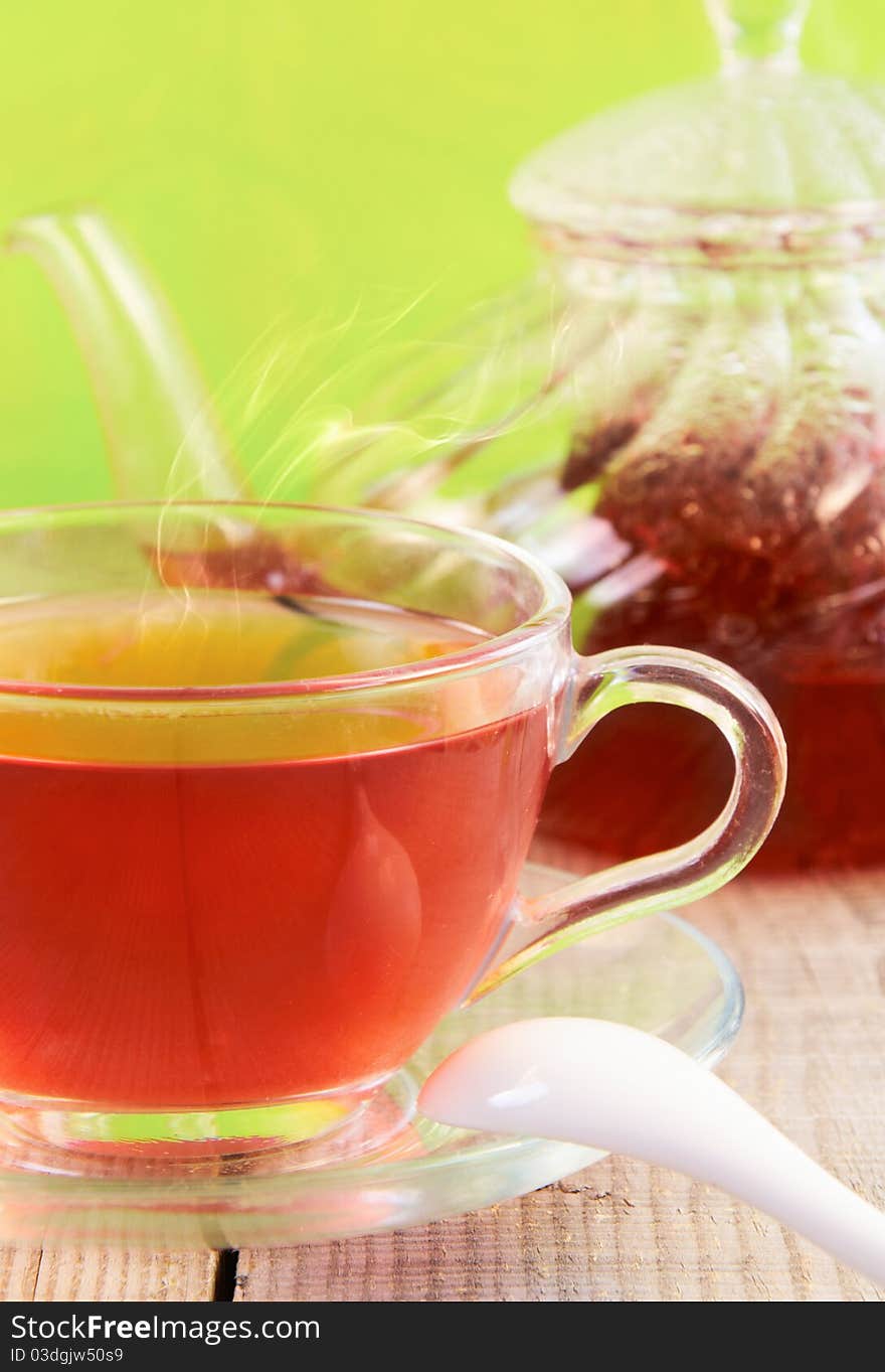 Tea still life. A cup of hot tea in the foreground