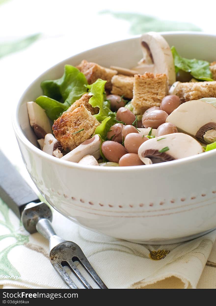Bean and fresh mushrooms appetizer with lettice and crouton