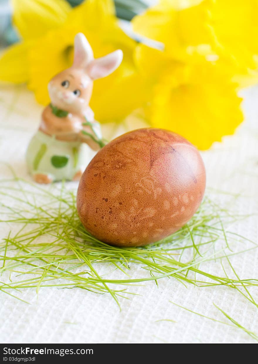 Easter Egg on kitchen towl with flower on background