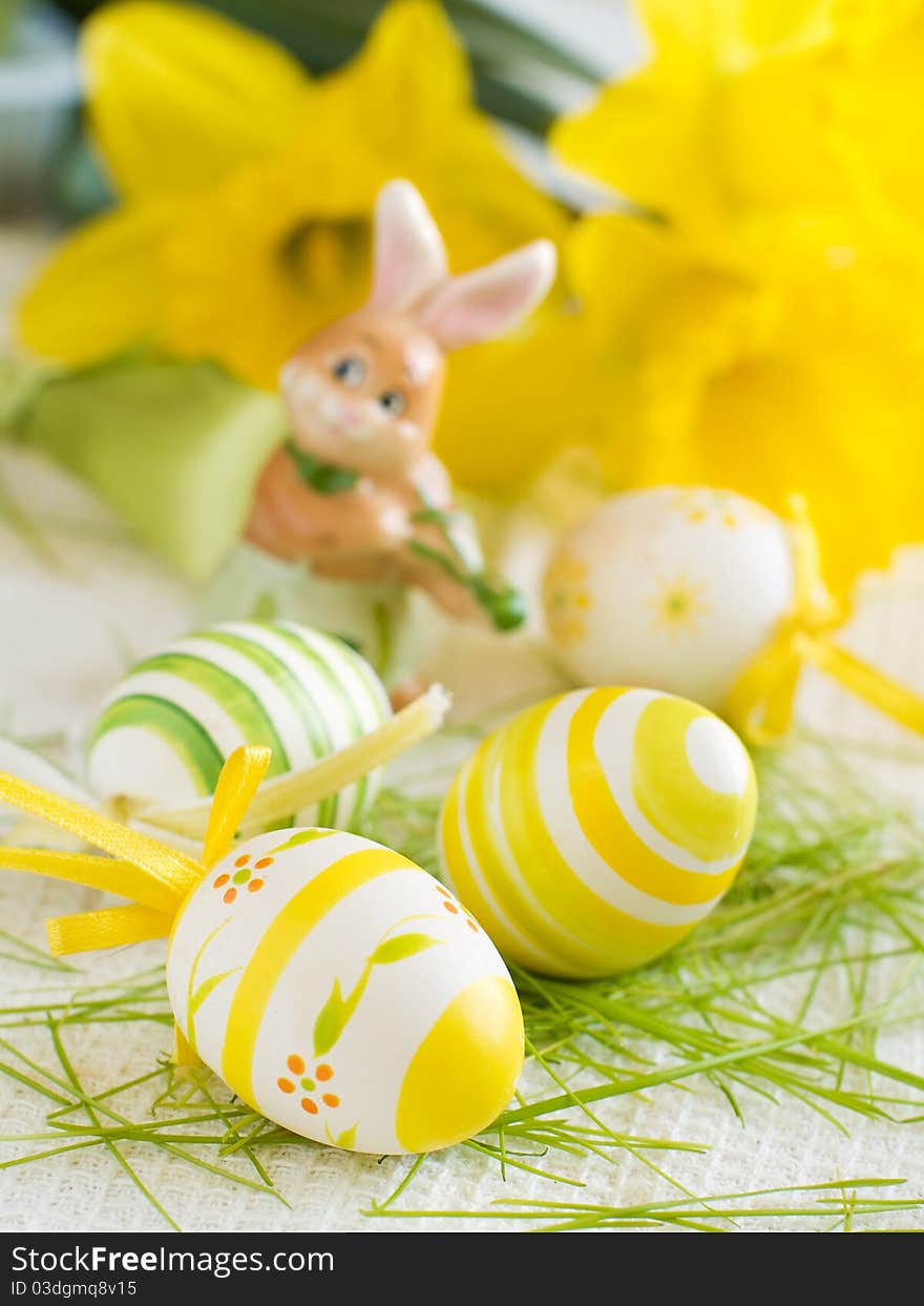 Easter Eggs on kitchen towl with flower on background