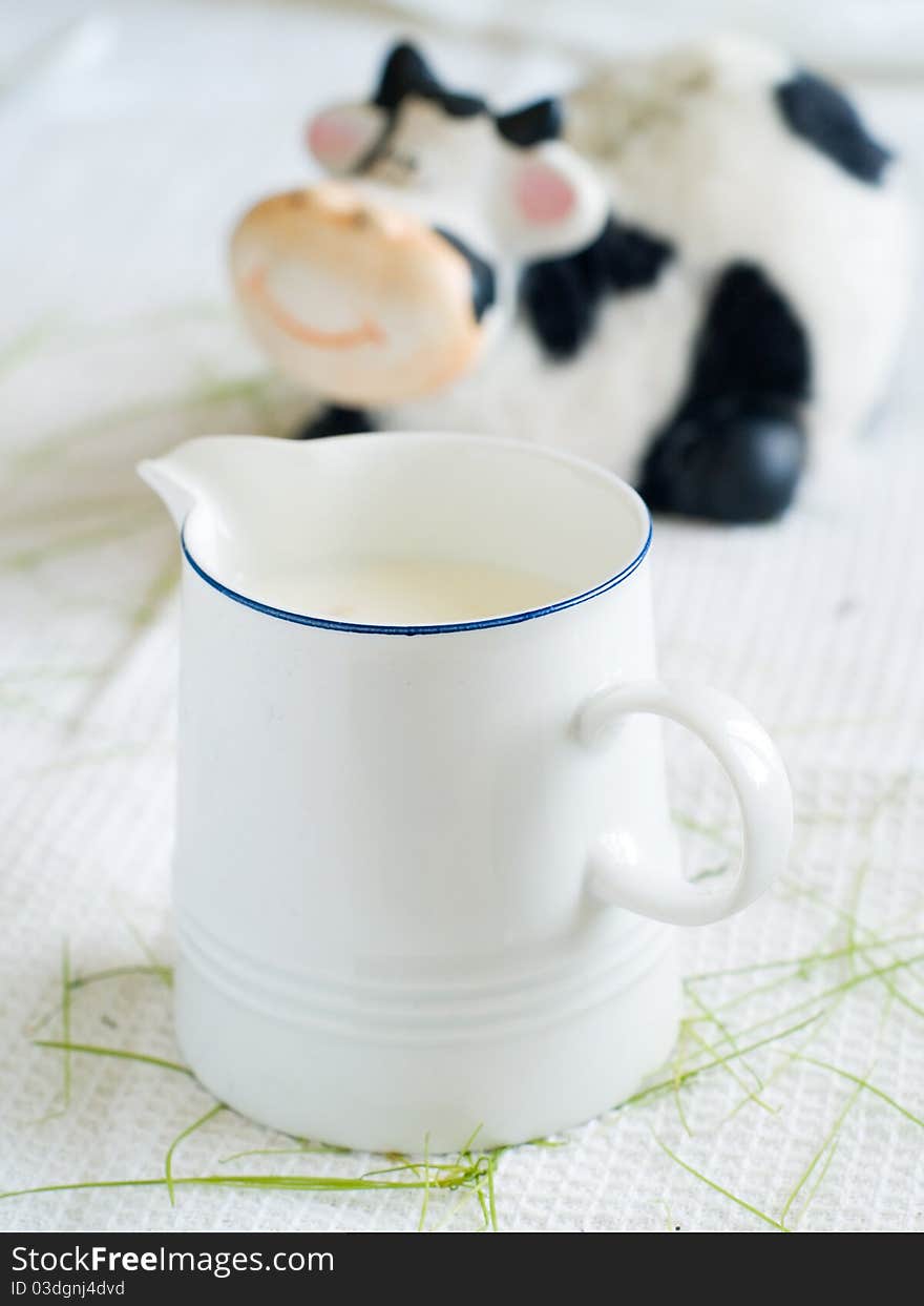 Milk with cow on background