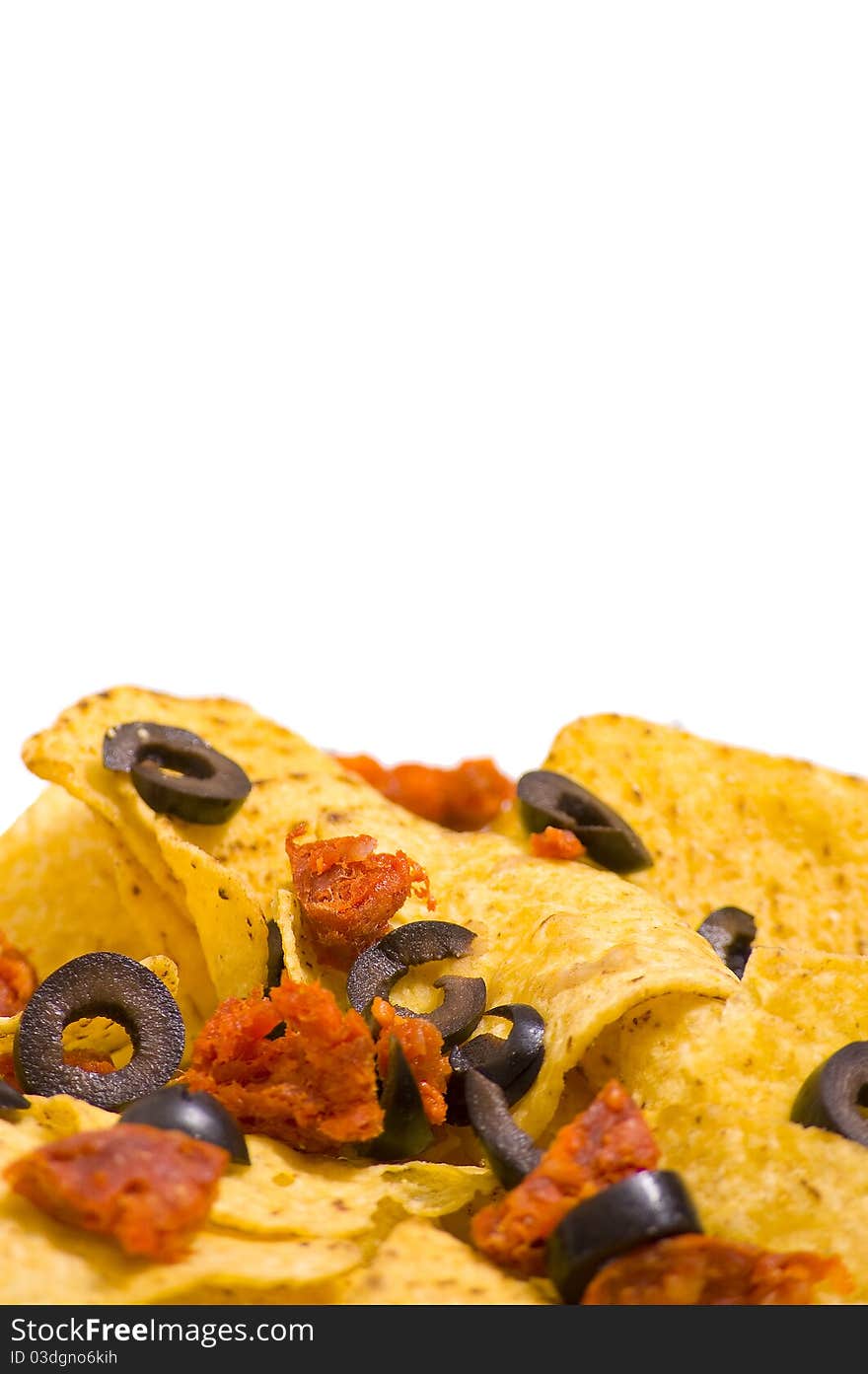 Nacho chips with olives and chorizo