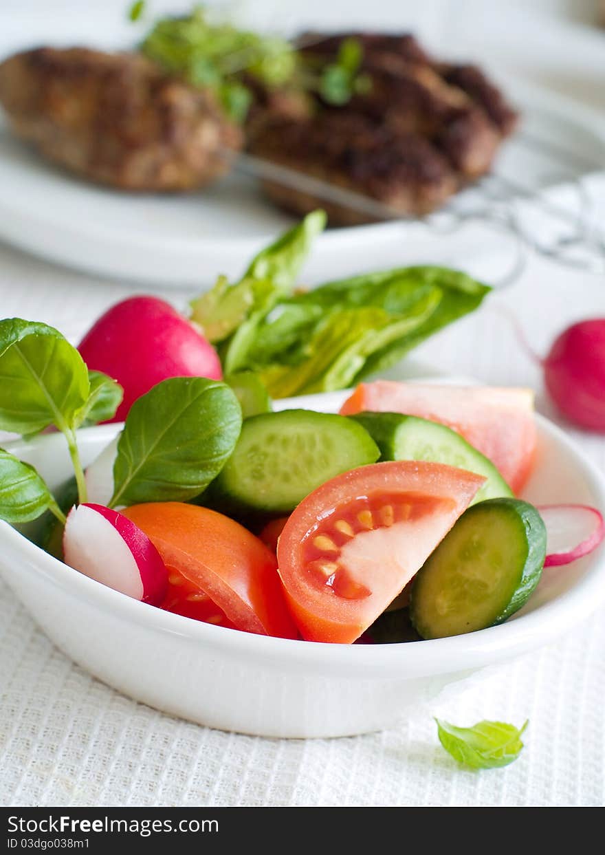 Mixed salad of fresh cucumbers and tomatoes