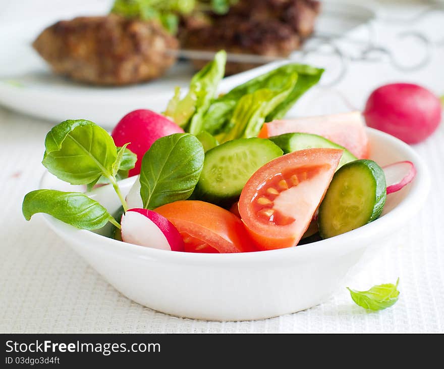 Mixed salad of fresh cucumbers and tomatoes