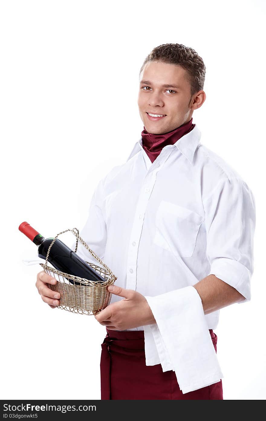 The young waiter with a bottle of wine on a white background. The young waiter with a bottle of wine on a white background