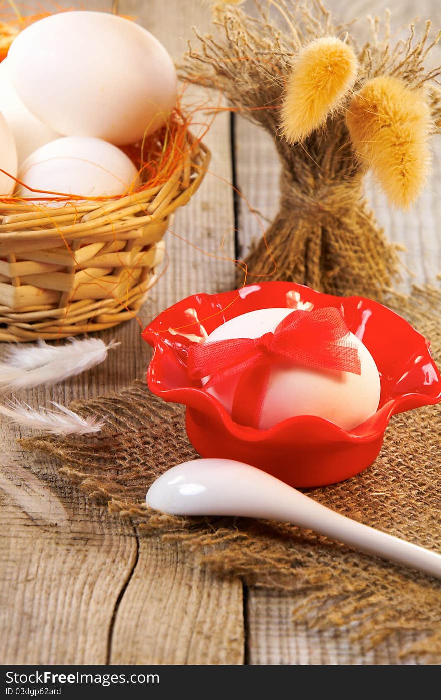 Easter still-life. Egg decorated with ribbon