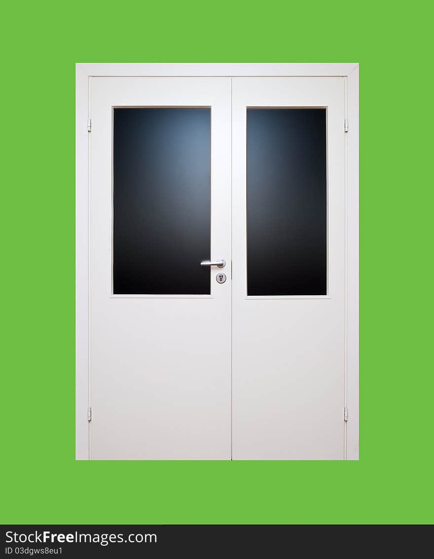 White closed door isoleted on green background (clipping path). White closed door isoleted on green background (clipping path)