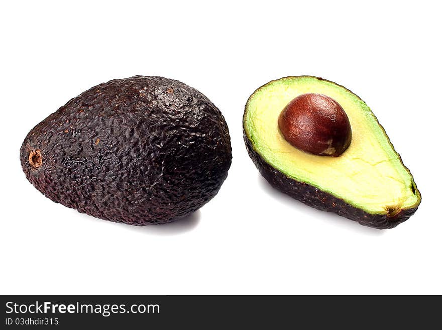 Avocado whole and half isolated on a white background