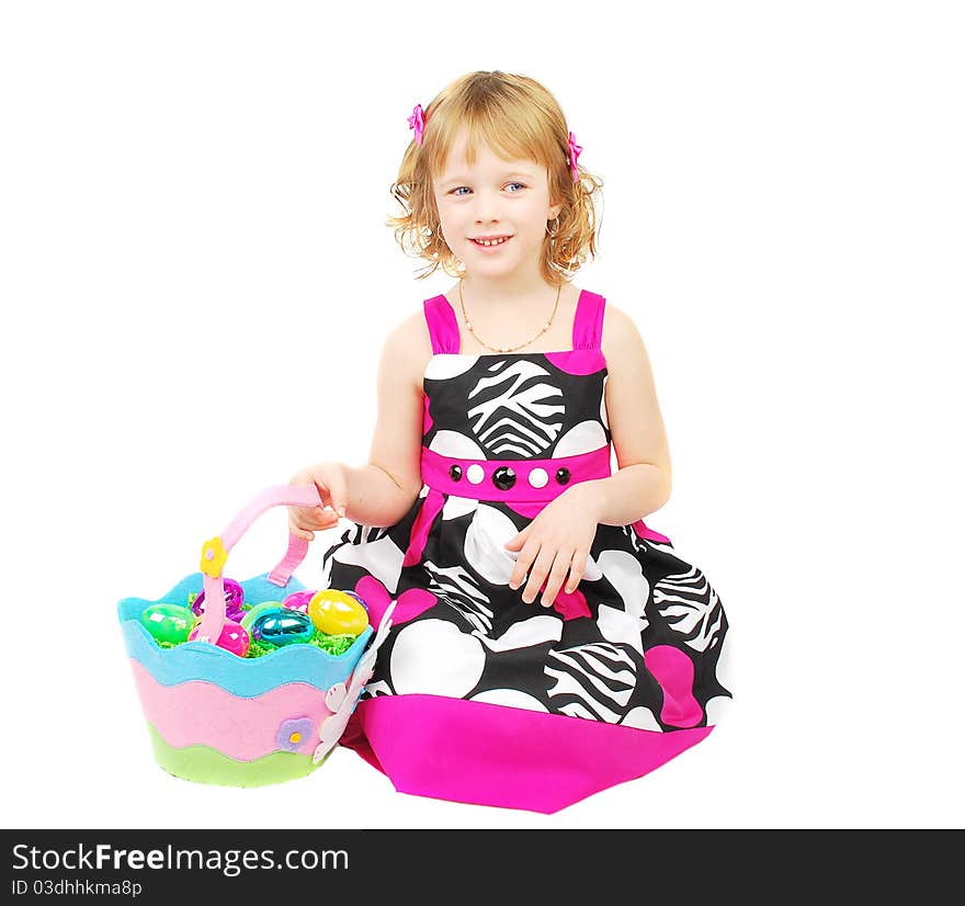 Little girl with Easter eggs in a basket. Little girl with Easter eggs in a basket