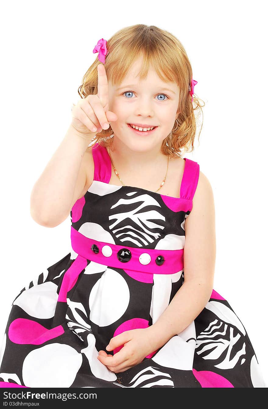 Portrait of a happy little girl on the white background with attention sign.