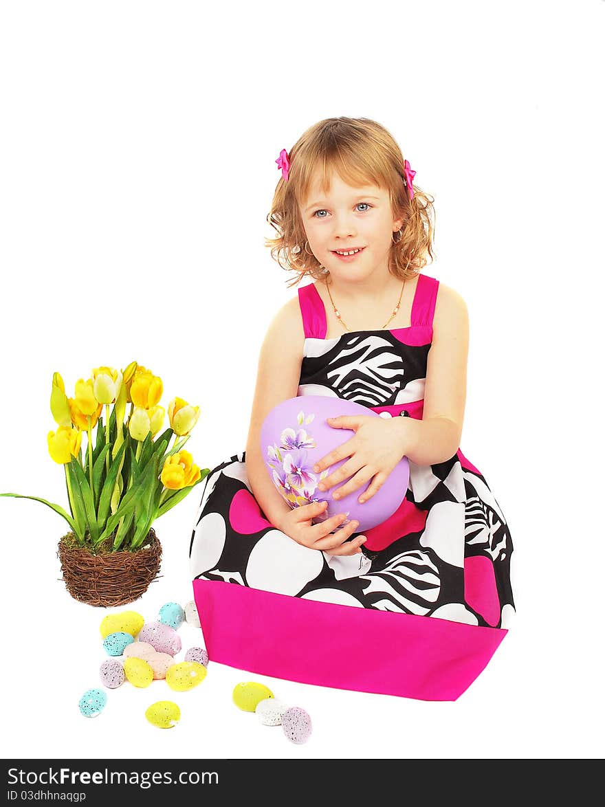 Portrait of a happy little girl with big easter egg, flowers on the white background.