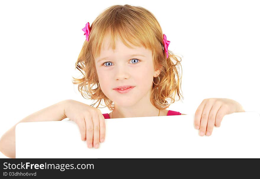 Smiling little adorable  girl holding empty white board isolated on the white. Smiling little adorable  girl holding empty white board isolated on the white.