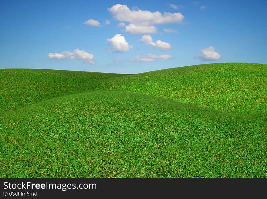 Picturesque landscape with green field and blue sky. Picturesque landscape with green field and blue sky