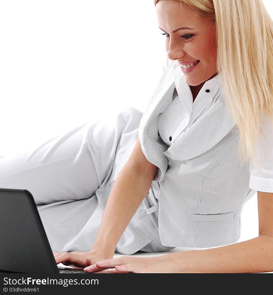 Business woman lies and working on laptop