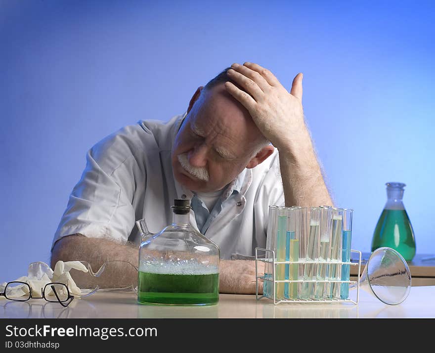 Scientist working witch chemicals having a headache